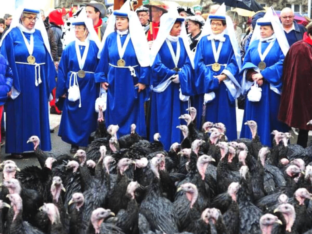 Nuns un blue habits chasing turkeys in a street