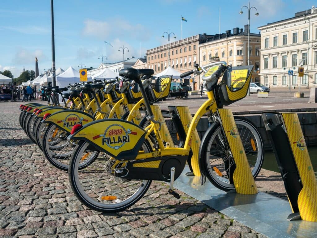 a line of yellow electric bikes