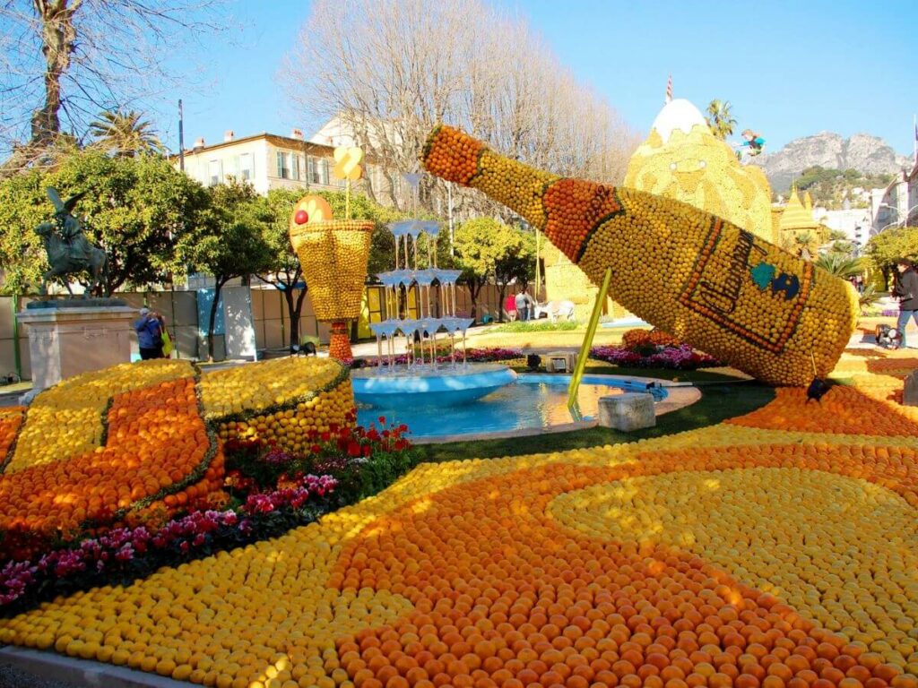 A big champagne bottle made out of lemons and oranges as part of the citron festival in France