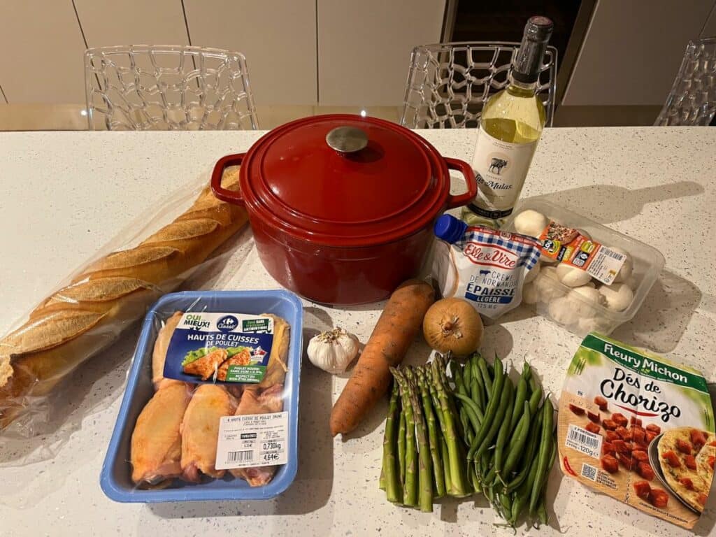 Ingredients on a kitchen worktop to cook Coq au Vin