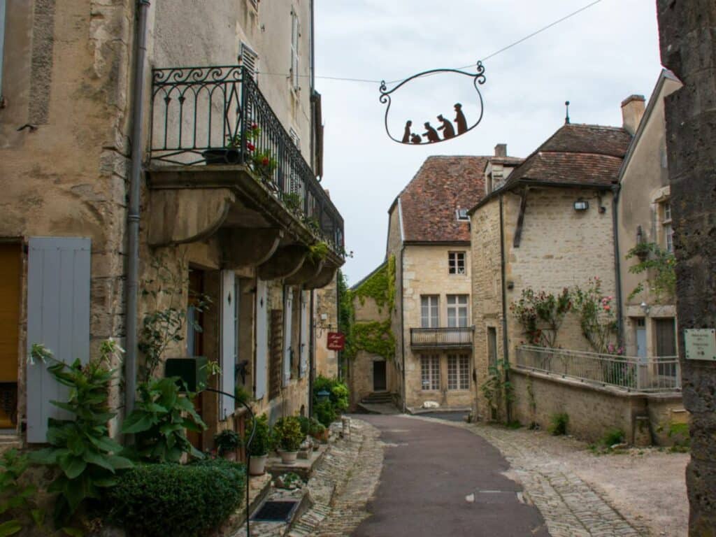 Old street with houses and stone buildings in Flafibny-sur-ozerain in France