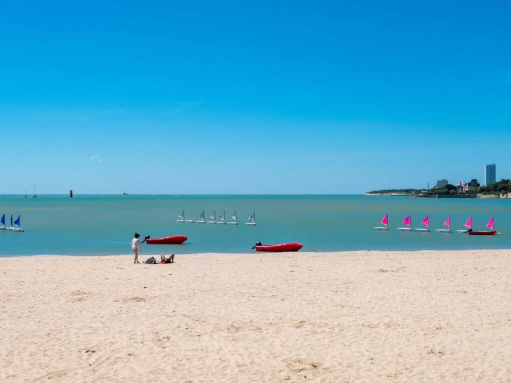 A stretch of white sandy beach and the atlantic ocean in La Rochelle