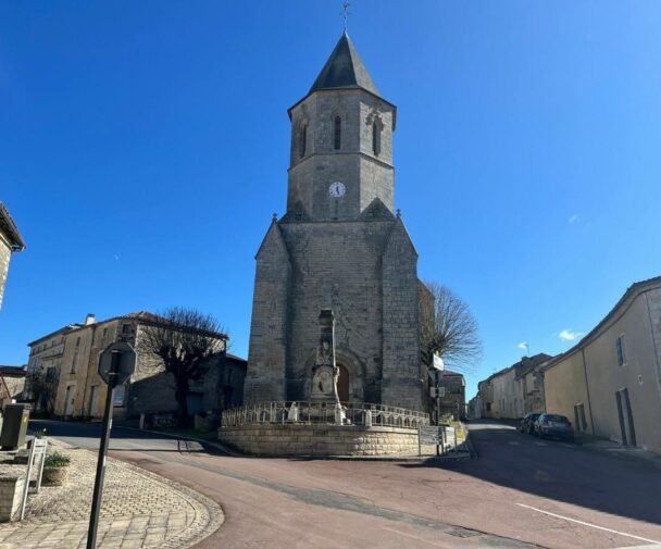 An old church set against a bright blue sky