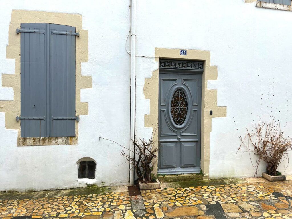 A architectural grey door and shutters in a French village