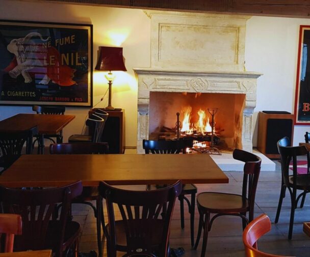 A cosy fireplace in an old restaurant in France