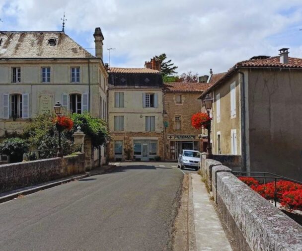 A road across the bridge in Verteuil leading to the village