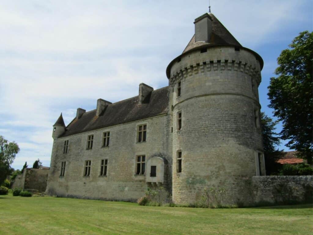 An old castle surrounded by grass in Bayers in the Charente in France