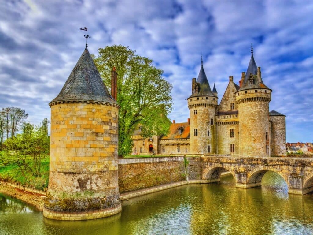 A beautiful old French chateau with water around