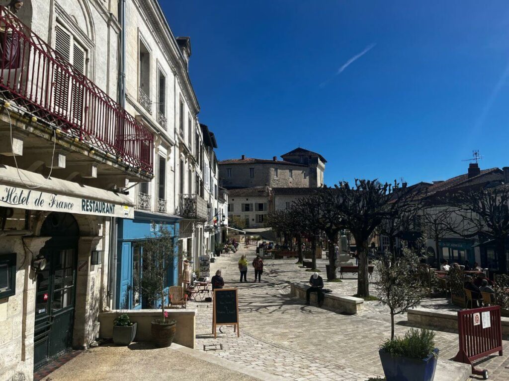 An old market square with shops in the middle of Aubeterre-sur-Dronne