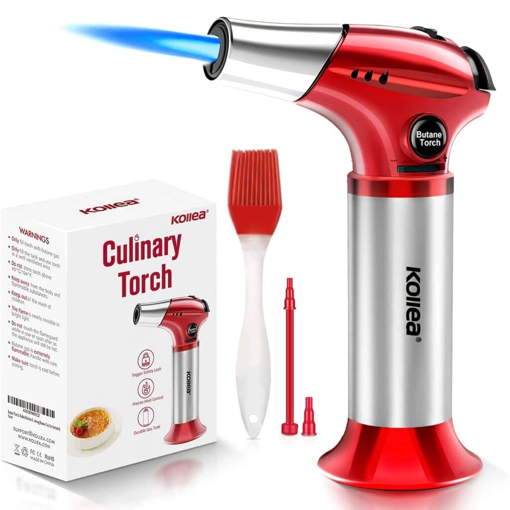 Red culinary torch with blue flame next to its packaging box labeled 'Kollea Culinary Torch', including a silicone brush and two nozzles, on a white background.