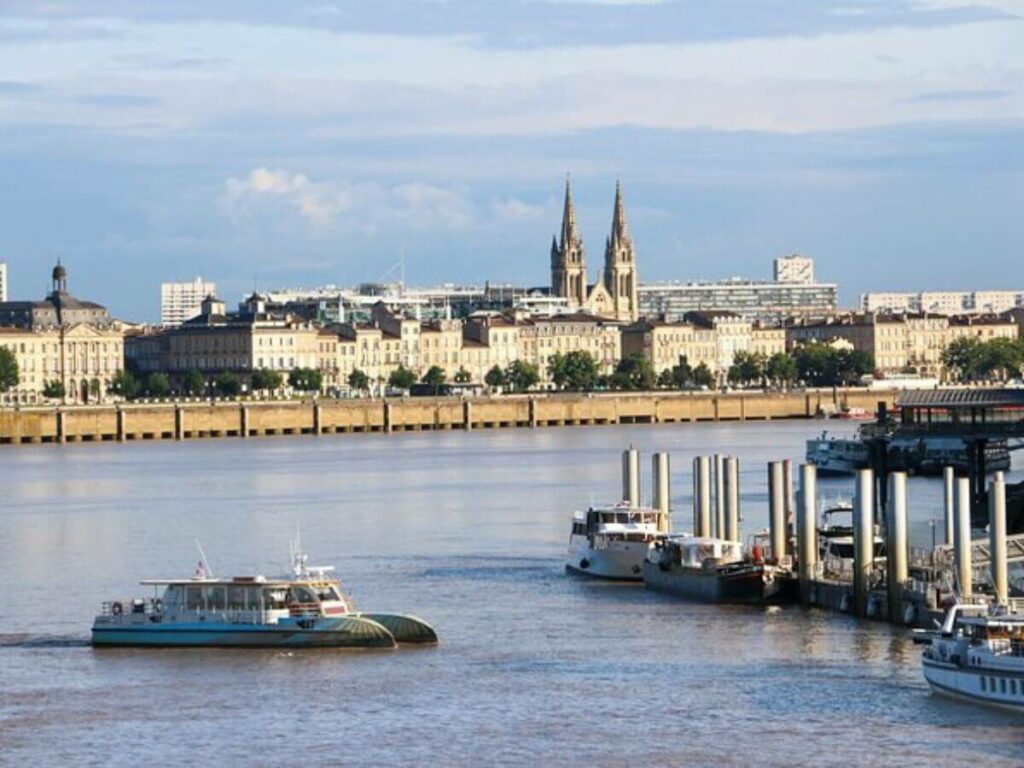 A panoramic view of Bordeaux and the river Garonne with boats