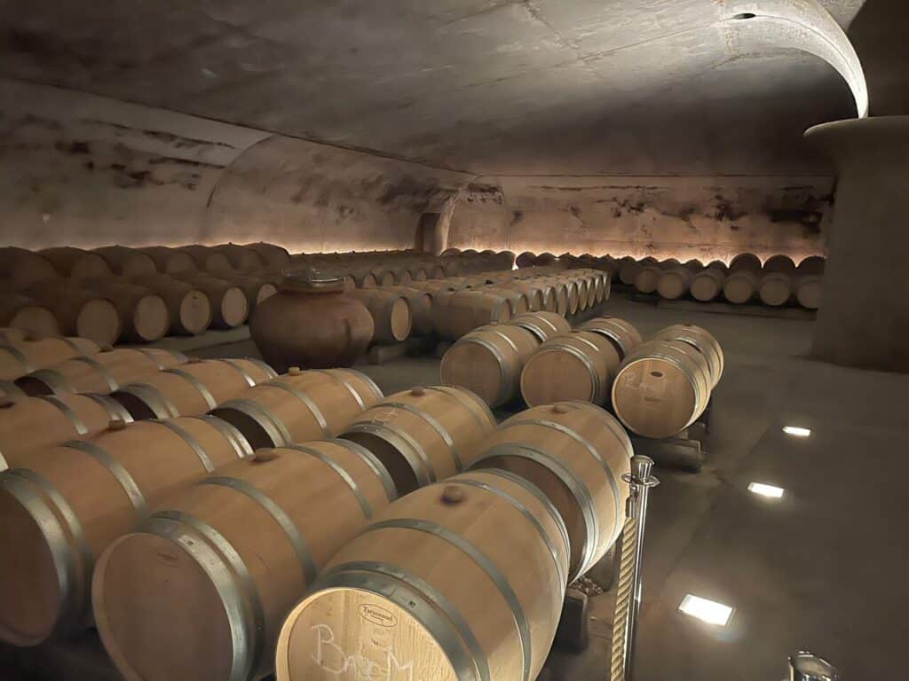 Rows of barrels in a wine cellar in Bordeaux