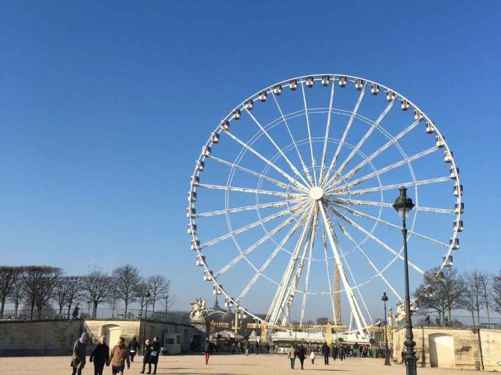 The Paris Eye Ferris Wheel against a blue sky in France
