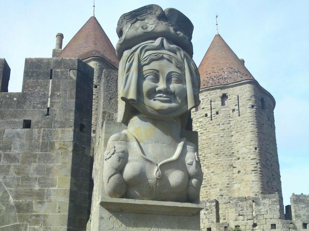 The concrete bust of Lady Carcas on a wall at Carcassonne