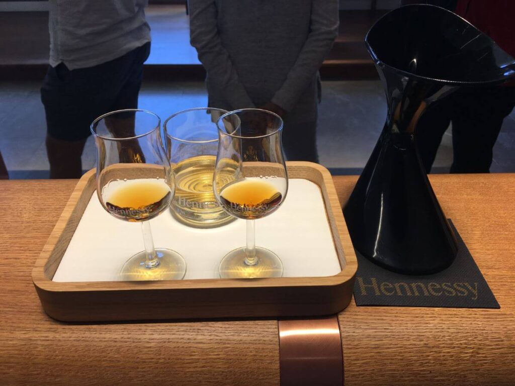 Three glasses of Cognac on a tray in a tasting room in the Hennessey Cognac House in France