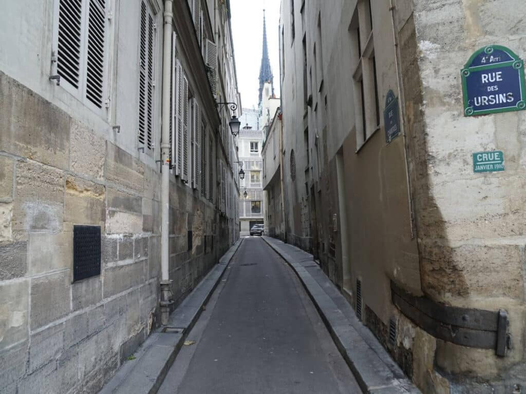 A deserted narrow street in paris highlighting spooky things to do in paris