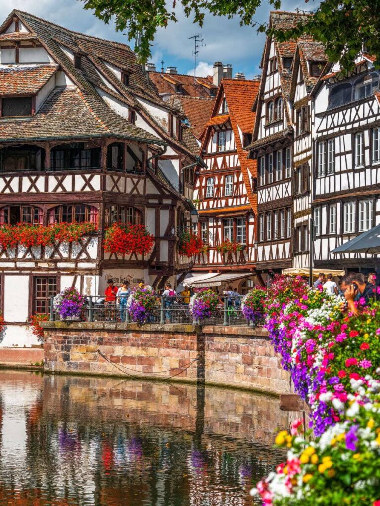 Old timbered colourful buildings by the water in Strasbourg in France