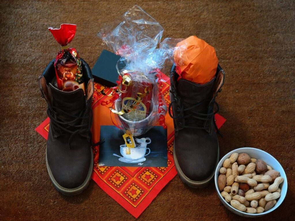 Two boots filled with gifts from Saint Nicholas for Christmas in France