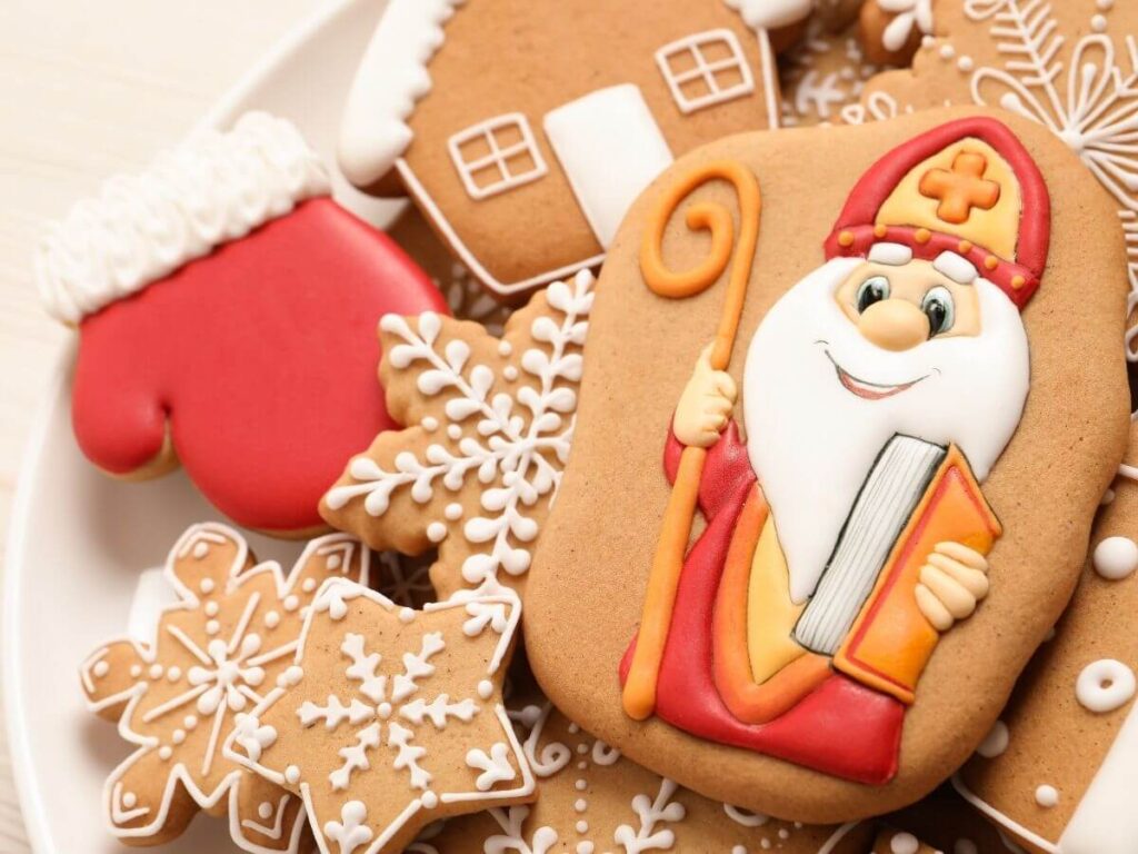 Christmas Cookies. Some are snow flakes, there is a gingerbread house ad one with Saint Nicholas on it