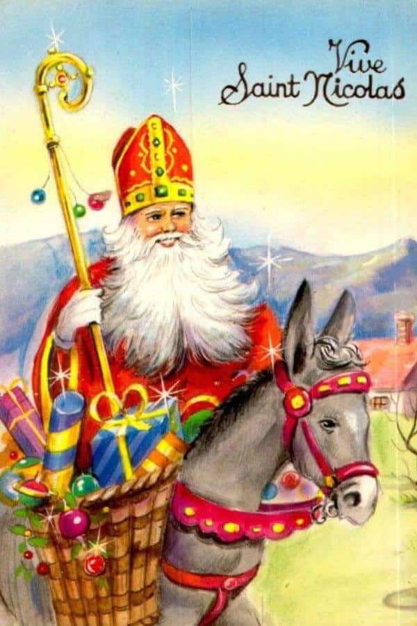 A picture of Saint NIcholas on a donkey with a basket of presents