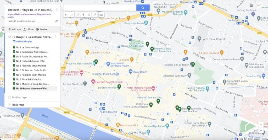 A map highlighting the top 10 attractions in Rouen, France, with markers indicating their locations. The listed attractions include Le Gros-Horloge, Cathédrale Notre-Dame de Rouen, Palais de Justice de Rouen, Historial Jeanne d'Arc, Place du Vieux Marché, St. Maclou Catholic Church, Fontaine Saint-Maclou, Aître Saint Maclou, Musée Le Secq des Tournelles, and Rouen Museum of Fine Arts. The map provides a visual guide to these points of interest, aiding in navigation and exploration of the city.