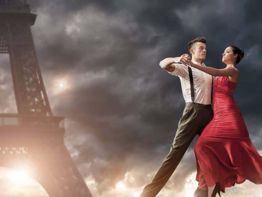 GPT A man and woman engaged in a dramatic tango pose with the Eiffel Tower in the background under a stormy sky. The man is dressed in a white shirt with suspenders and black pants, while the woman wears a flowing red dress.