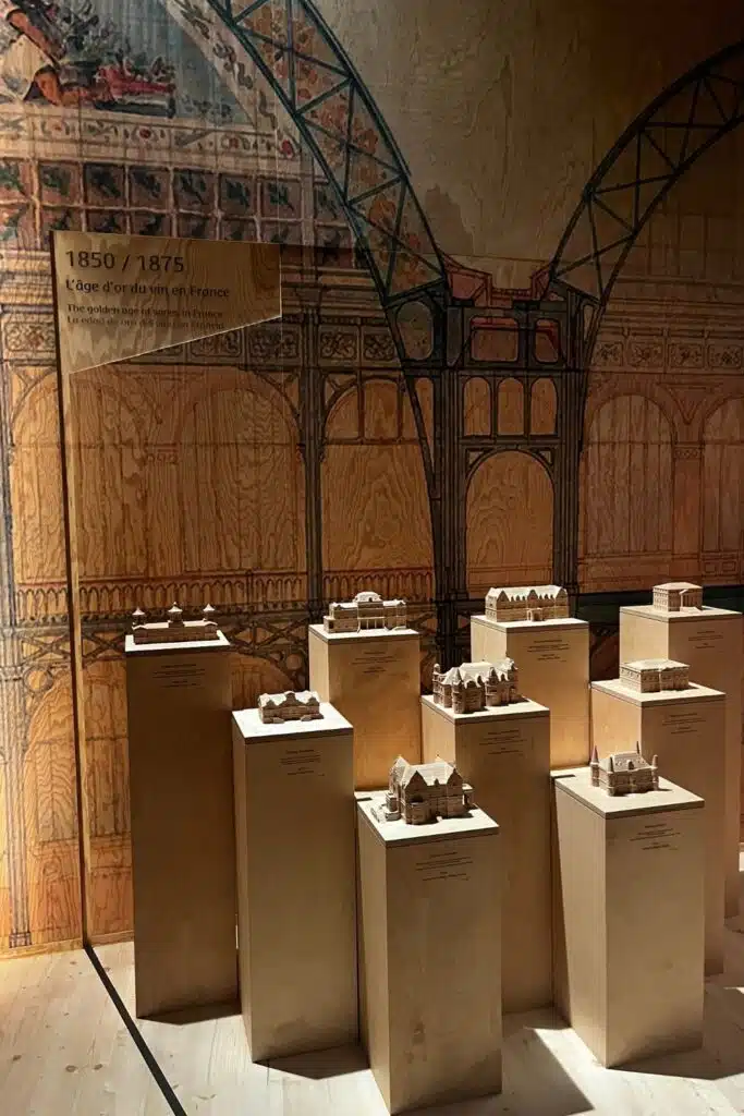 Models of historic buildings on pedestals.