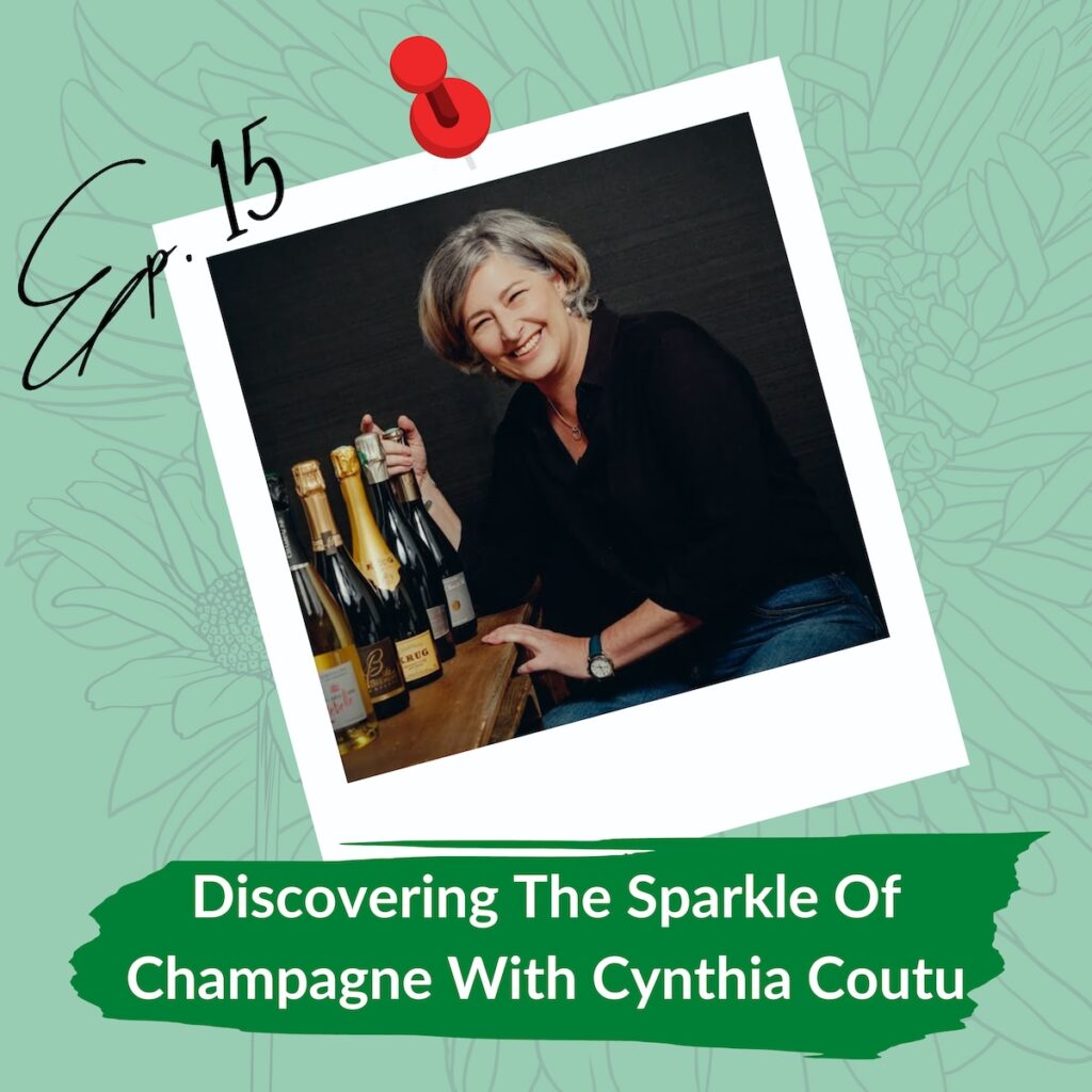 A cheerful woman with short gray hair, Cynthia Coutu, is seated beside several bottles of champagne. The image has a pinned polaroid style overlay with "Ep. 15" handwritten at the top. Below, there is a green banner with the text "Discovering The Sparkle Of Champagne With Cynthia Coutu." The background is a subtle floral design.