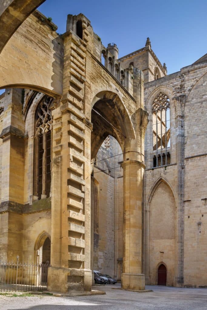 View of ancient Roman ruins in Narbonne, France, showcasing stone pathways and remnants of historic architecture. These ruins highlight the city’s Roman influence and historical significance.