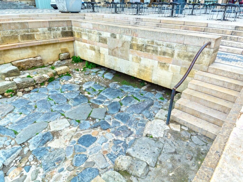View of ancient Roman ruins in Narbonne, France, showcasing stone pathways and remnants of historic architecture. These ruins highlight the city’s Roman influence and historical significance.