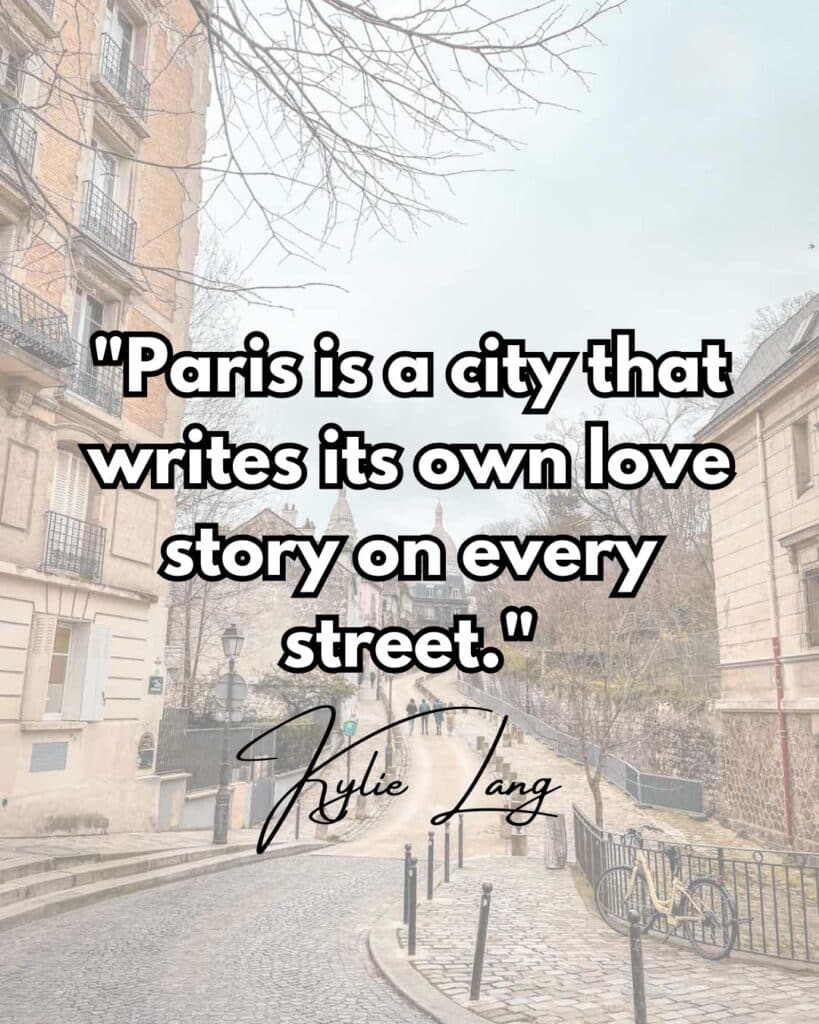 A serene Parisian street scene with cobblestone paths, classic buildings, and leafless trees on a quiet day. The image features an overlaid quote that reads, "Paris is a city that writes its own love story on every street." The quote is attributed to Kylie Lang, written in a cursive signature.