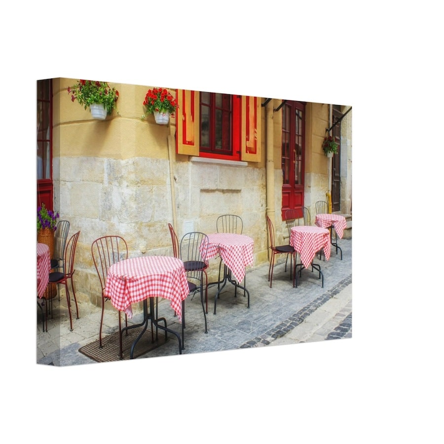 A canvas print featuring a classic French bistro scene with tables draped in red-checkered cloths outside a quaint café, symbolizing the charm and warmth of Parisian outdoor dining.