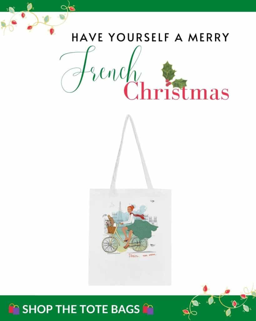 A tote bag featuring an illustration of a stylish woman cycling with the Eiffel Tower in the background, accompanied by the text "Have Yourself a Merry French Christmas" in festive red and green at the top.