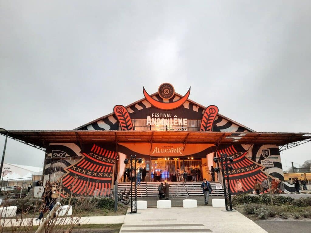 The entrance of the Angoulême International Comic Strip Festival, decorated with bold graphic designs, held annually in January in France, celebrating the art of comics and graphic novels.