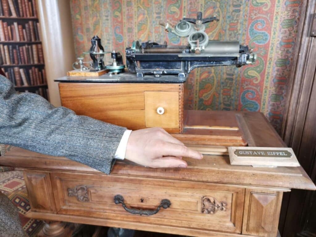 A vintage-style room inside the Eiffel Tower Apartment, showcasing its historical charm that has inspired many books and films.