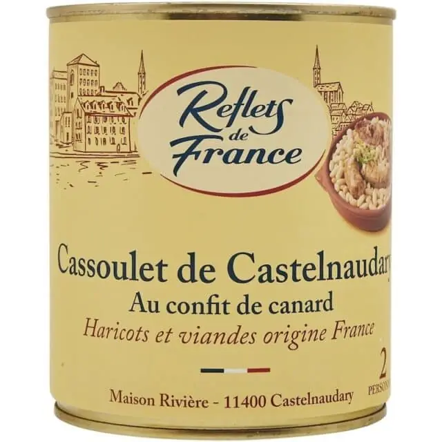 A can of "Cassoulet de Castelnaudary" by Reflets de France, highlighting its use of duck confit and French-sourced meats and beans, packaged with vintage-style branding.